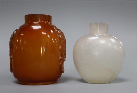 A Chinese agate snuff bottle and an amber glass snuff bottle